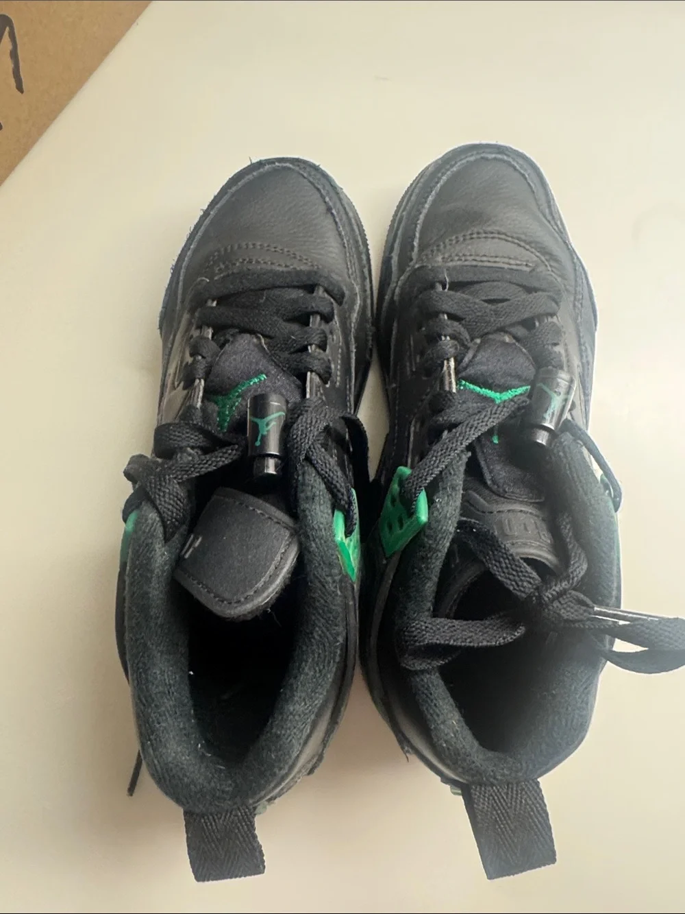 Nike Jordan’s Kids Black Sneakers with Green Accents
